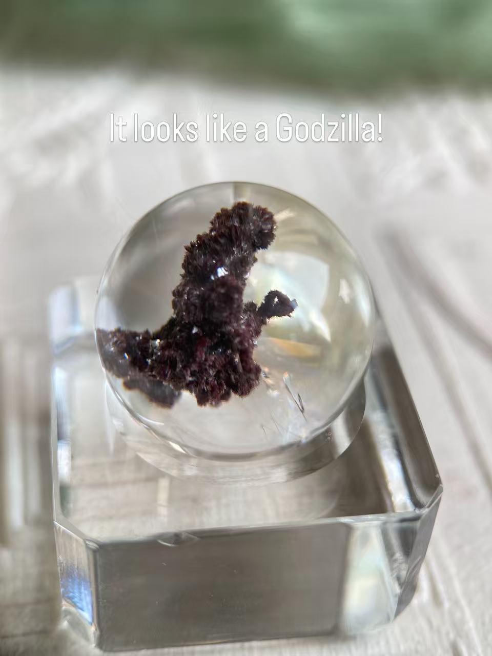 Sealed Godzilla crystal sphere showing Godzilla silhouette