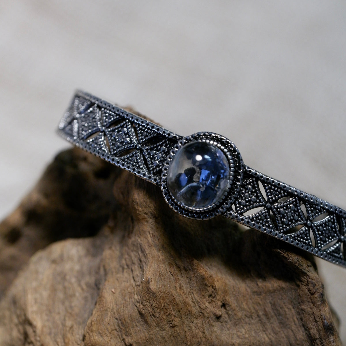 "Azure Filigree" — Blue Mineral Quartz Cabochon & Openwork Silver Bangle