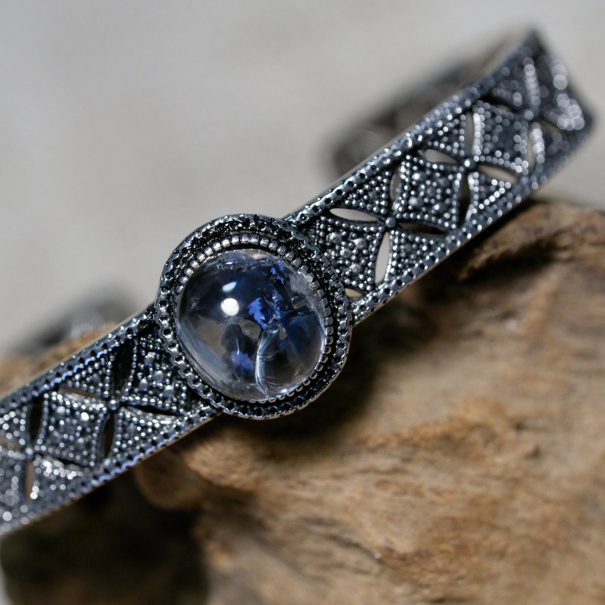 "Azure Filigree" — Blue Mineral Quartz Cabochon & Openwork Silver Bangle