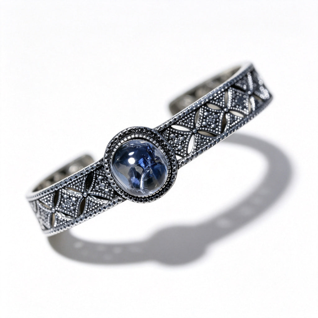 "Azure Filigree" — Blue Mineral Quartz Cabochon & Openwork Silver Bangle
