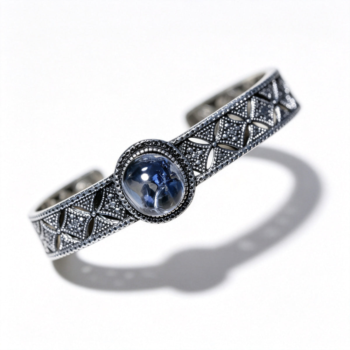 "Azure Filigree" — Blue Mineral Quartz Cabochon & Openwork Silver Bangle